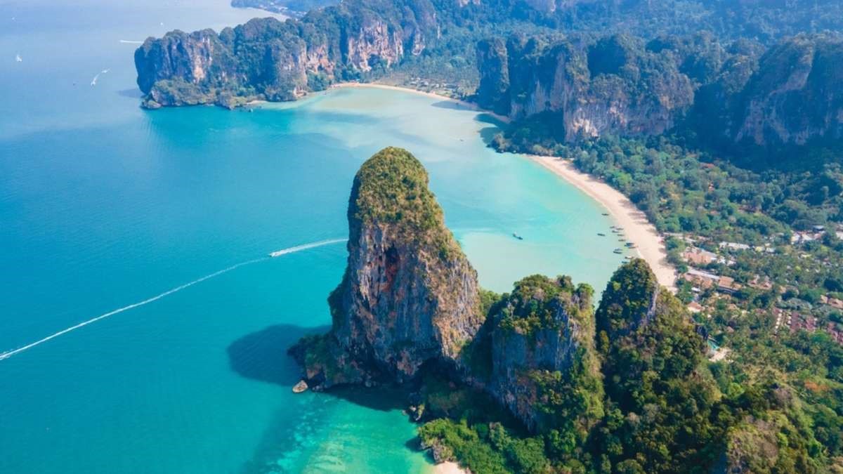 Beach, mountain range, and city skyline for budget-friendly travel inspiration.